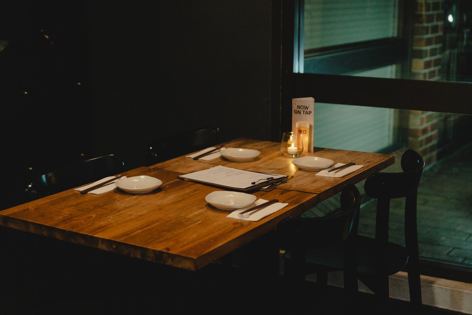 A warmly lit table at Sake Zen